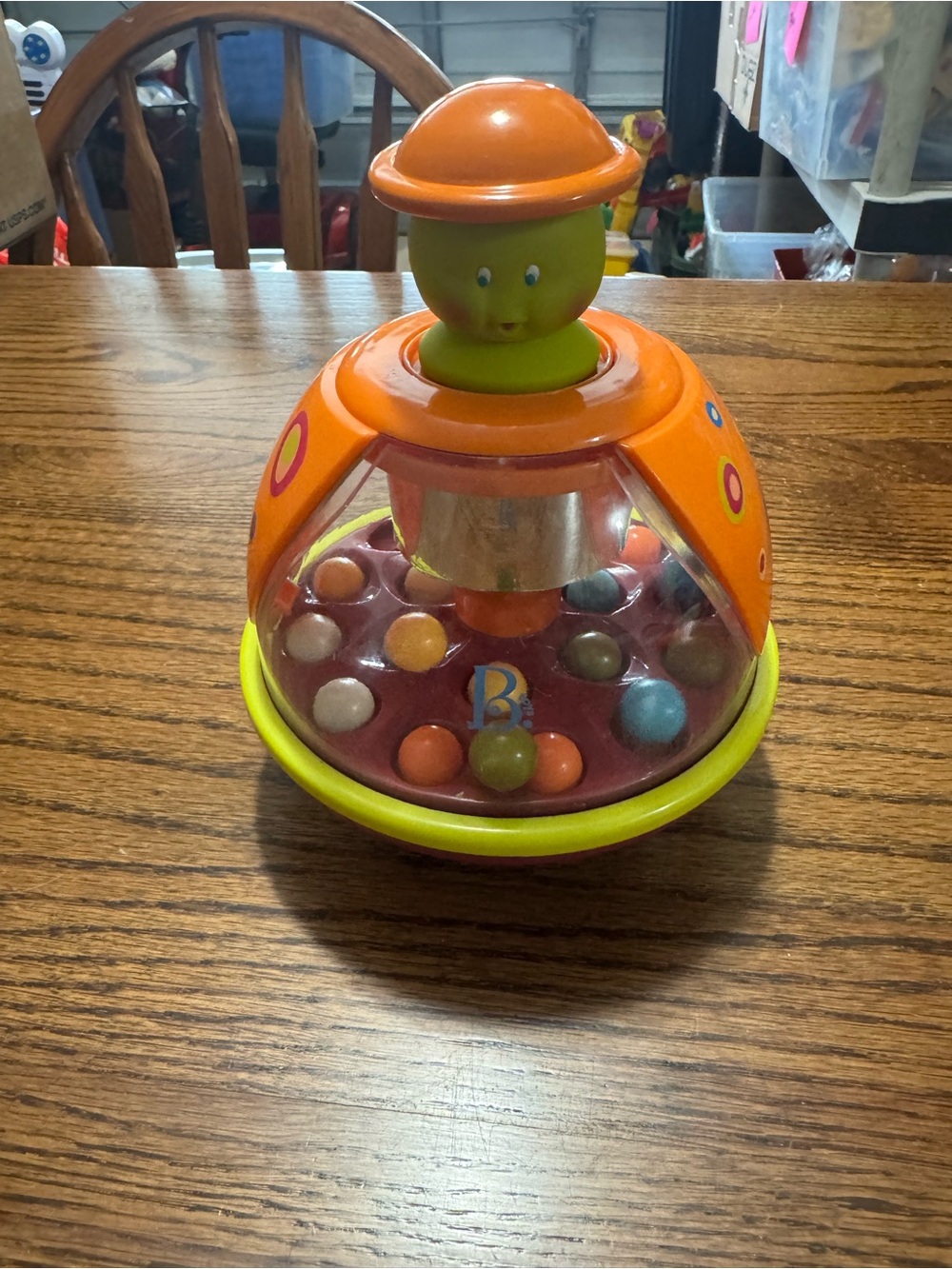 Bright Orange and Green Spinning Pop Toy for Toddlers - Brand